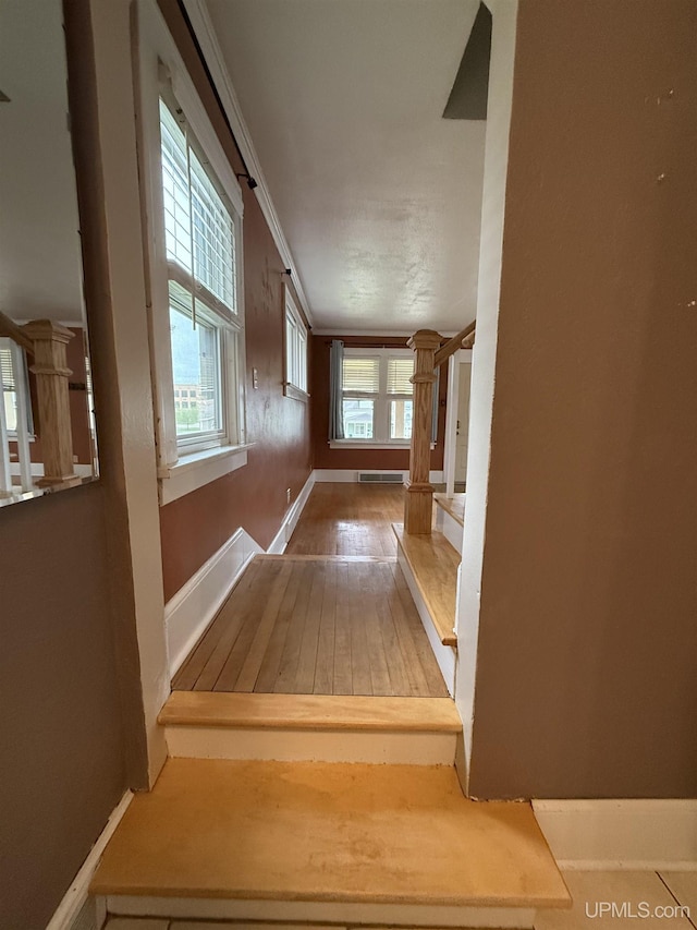 404 W Ludington St, Iron Mountain, MI 49801 - hallway featuring baseboards and hardwood / wood-style floors