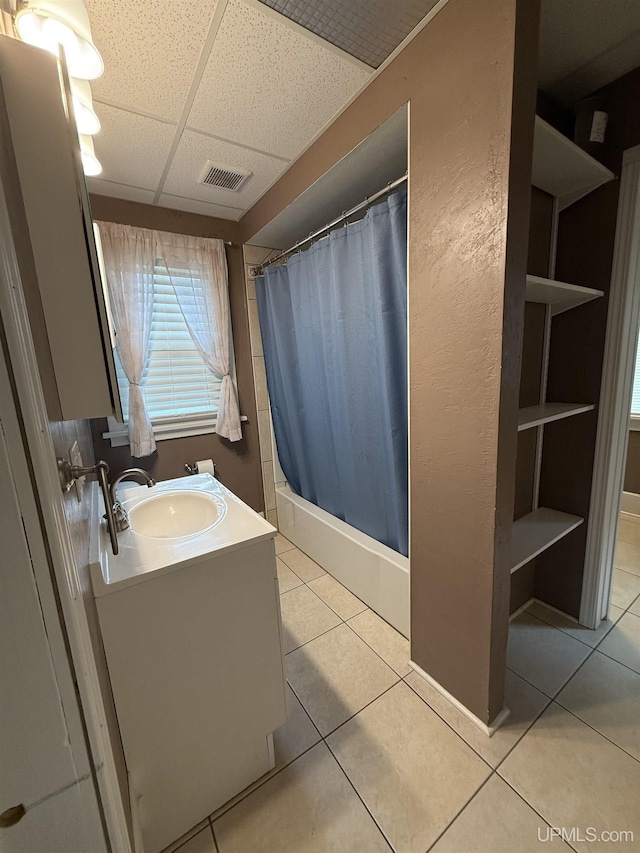404 W Ludington St, Iron Mountain, MI 49801 - bathroom with a drop ceiling, tile patterned floors, curtained shower, and vanity