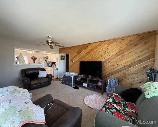 99 N Mitchell St, Gwinn, MI 49841 - living area with wooden walls, carpet, and ceiling fan