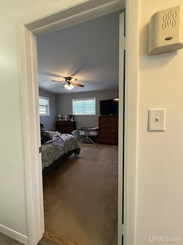 99 N Mitchell St, Gwinn, MI 49841 - carpeted bedroom featuring ceiling fan