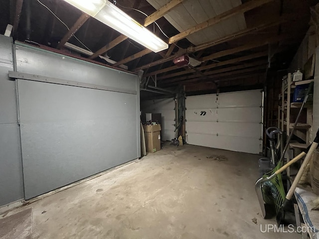 99 N Mitchell St, Gwinn, MI 49841 - garage featuring a garage door opener