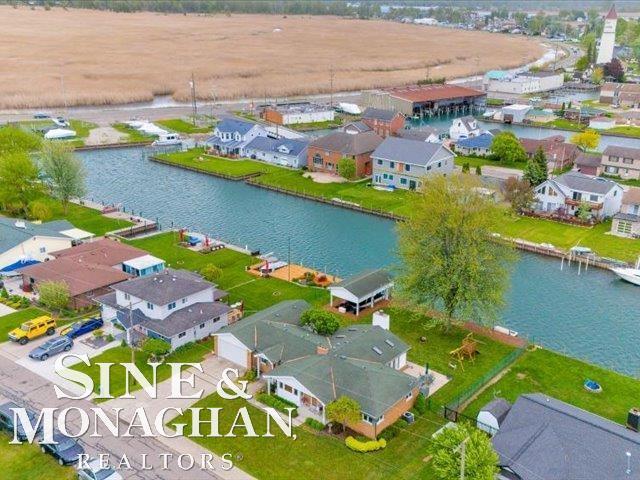 aerial view of residential area with a large body of water
