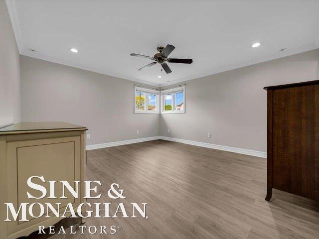 spare room featuring a ceiling fan, wood finished floors, baseboards, and recessed lighting