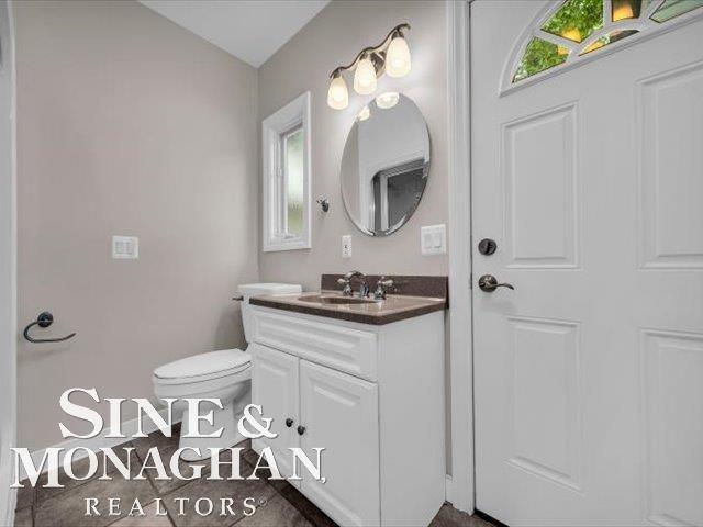 bathroom featuring vanity and toilet
