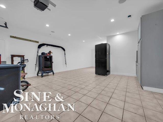 workout area with recessed lighting and light tile patterned floors