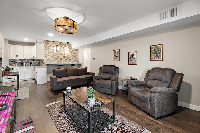 2102 Pauline Blvd Unit 304, Ann Arbor, MI 48103 - living area featuring dark wood finished floors, recessed lighting, and baseboards