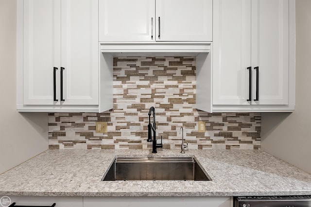 2102 Pauline Blvd Unit 304, Ann Arbor, MI 48103 - kitchen featuring a sink, decorative backsplash, and white cabinets