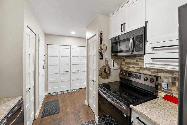 2102 Pauline Blvd Unit 304, Ann Arbor, MI 48103 - kitchen featuring stainless steel appliances, tasteful backsplash, dark wood-type flooring, white cabinetry, and recessed lighting