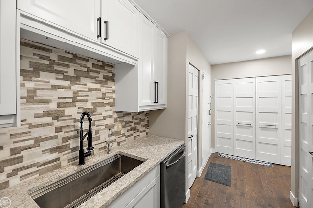 2102 Pauline Blvd Unit 304, Ann Arbor, MI 48103 - kitchen featuring a sink, dishwasher, light stone countertops, dark wood-type flooring, and backsplash