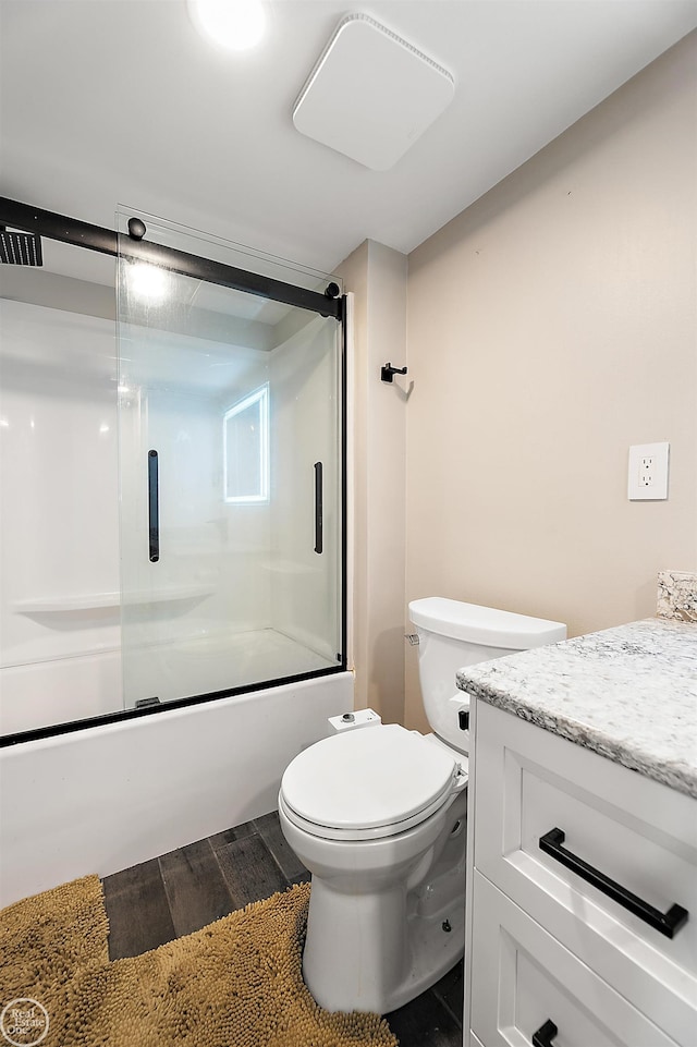 2102 Pauline Blvd Unit 304, Ann Arbor, MI 48103 - full bathroom with wood finished floors, combined bath / shower with glass door, toilet, and vanity