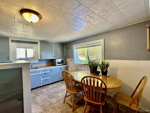 518 Lynn St, Munising, MI 49862 - dining area featuring wainscoting