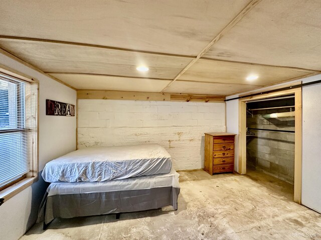 518 Lynn St, Munising, MI 49862 - bedroom with unfinished concrete flooring