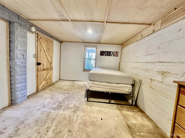518 Lynn St, Munising, MI 49862 - bedroom featuring unfinished concrete flooring