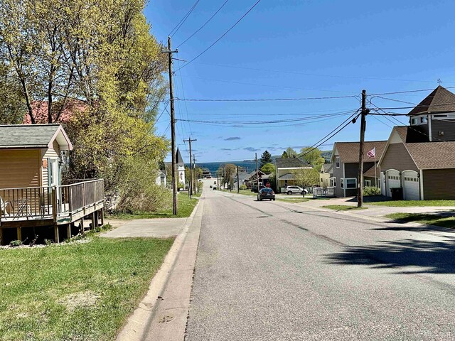 518 Lynn St, Munising, MI 49862 - view of asphalt road with a residential view and curbs