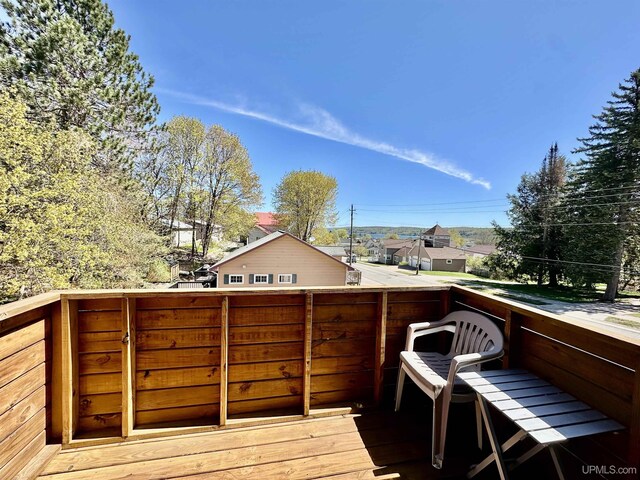518 Lynn St, Munising, MI 49862 - wooden deck with a residential view