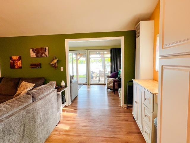 601 N Scott Dr, Farwell, MI 48622 - living area with light wood-style floors