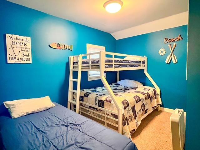 601 N Scott Dr, Farwell, MI 48622 - bedroom featuring vaulted ceiling and carpet