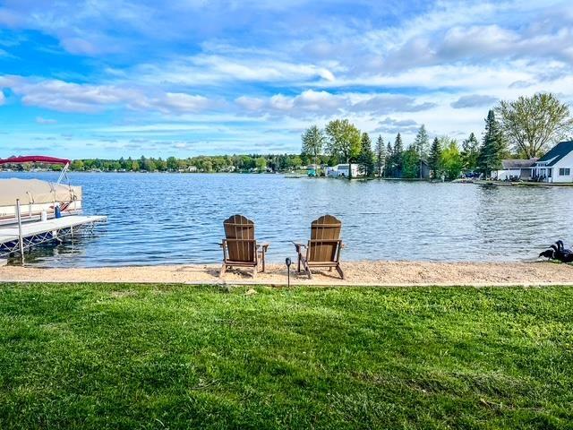 601 N Scott Dr, Farwell, MI 48622 - dock featuring a water view and a yard