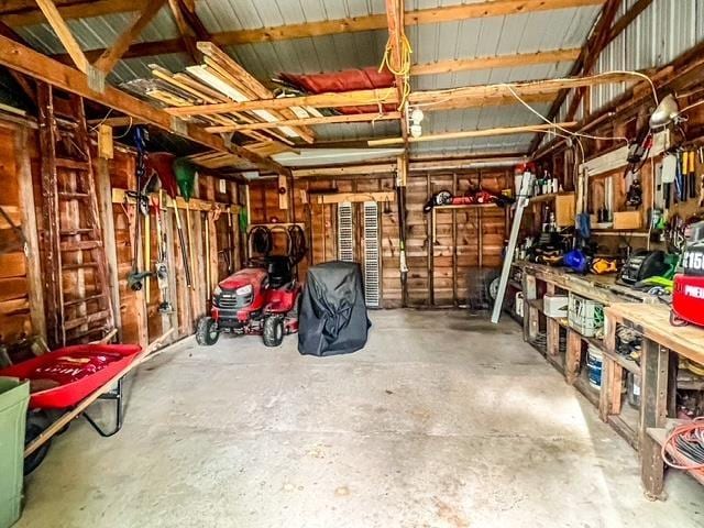 601 N Scott Dr, Farwell, MI 48622 - garage featuring a workshop area