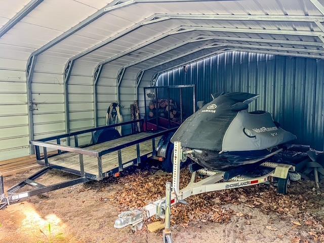 601 N Scott Dr, Farwell, MI 48622 - view of car parking with a detached carport
