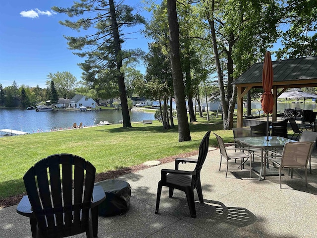 601 N Scott Dr, Farwell, MI 48622 - view of patio with a gazebo, a water view, and outdoor dining area