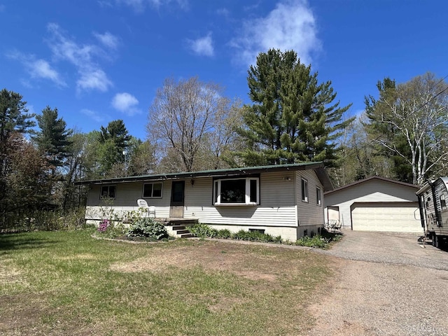 381 Mangum Rd, Marquette, MI 49855 - view of front of home with an outdoor structure, a front lawn, a garage, and driveway