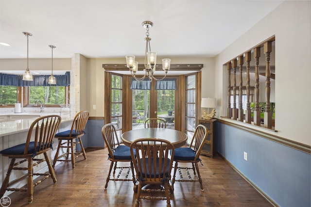 53638 Sherwood Ln, Shelby Twp, MI 48315 - dining room with a chandelier, wood finished floors, and baseboards