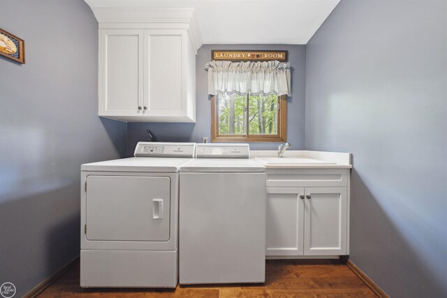 53638 Sherwood Ln, Shelby Twp, MI 48315 - laundry room with washer and dryer, cabinet space, dark wood-style floors, and baseboards