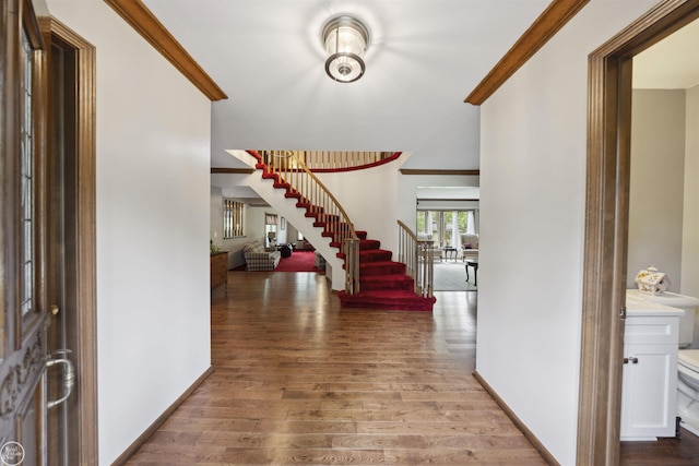 53638 Sherwood Ln, Shelby Twp, MI 48315 - entrance foyer with stairway, wood finished floors, baseboards, and crown molding