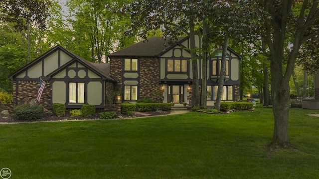 53638 Sherwood Ln, Shelby Twp, MI 48315 - english style home with a front lawn and brick siding