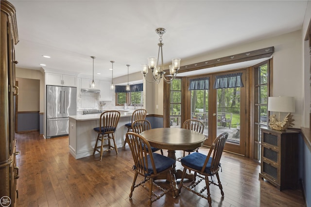 53638 Sherwood Ln, Shelby Twp, MI 48315 - dining area featuring french doors, dark wood-style flooring, recessed lighting, and a chandelier