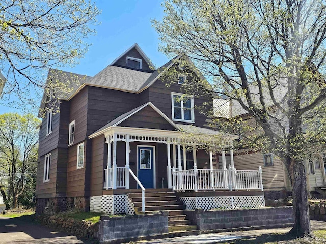 120 N Pewabic St, Laurium, MI 49913 - victorian home featuring covered porch and roof with shingles