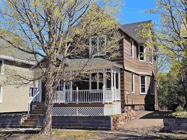120 N Pewabic St, Laurium, MI 49913 - view of front facade featuring a porch and a shingled roof