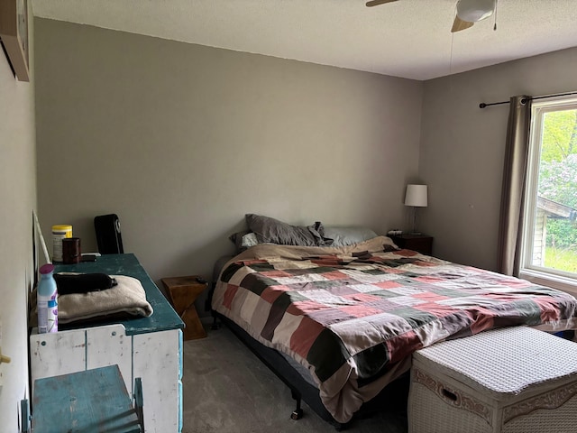 2913 W Howard Rd, Beaverton, MI 48612 - bedroom featuring carpet flooring, ceiling fan, and a textured ceiling