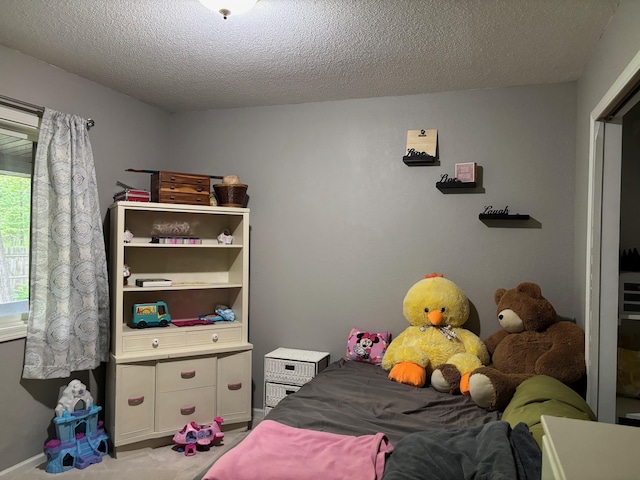 2913 W Howard Rd, Beaverton, MI 48612 - bedroom featuring a textured ceiling and carpet flooring