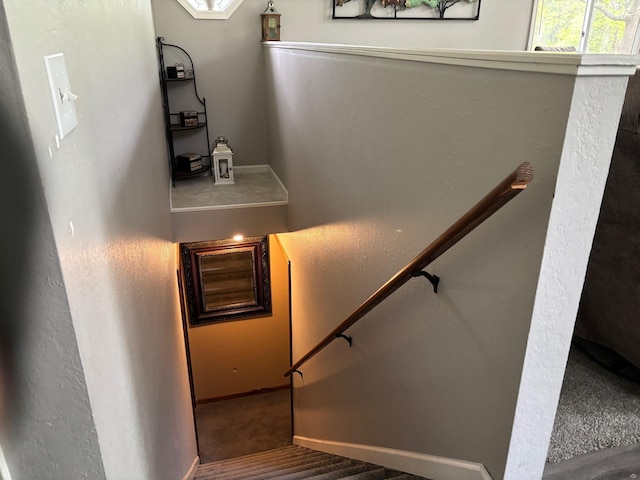 2913 W Howard Rd, Beaverton, MI 48612 - staircase featuring baseboards and carpet floors