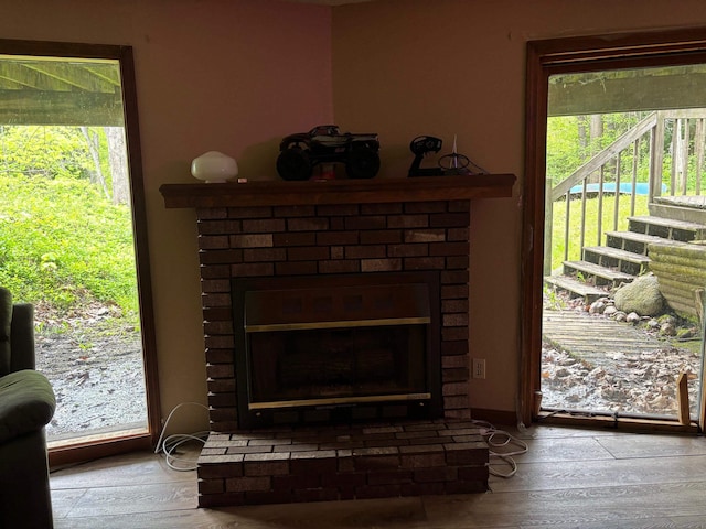 2913 W Howard Rd, Beaverton, MI 48612 - detailed view of a brick fireplace and wood finished floors