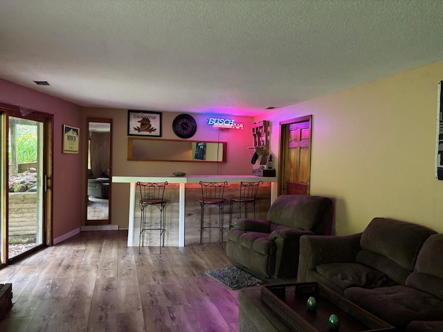 2913 W Howard Rd, Beaverton, MI 48612 - living room with wood finished floors and a textured ceiling