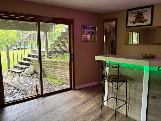 2913 W Howard Rd, Beaverton, MI 48612 - doorway to outside featuring wood finished floors and baseboards