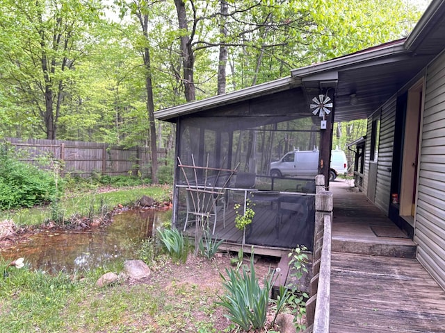 2913 W Howard Rd, Beaverton, MI 48612 - wooden deck with a sunroom