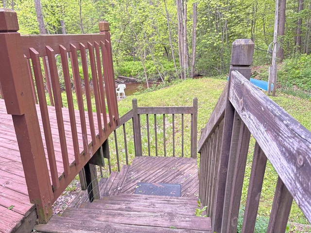 2913 W Howard Rd, Beaverton, MI 48612 - wooden deck with a wooded view