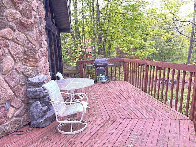 2913 W Howard Rd, Beaverton, MI 48612 - wooden deck featuring a grill