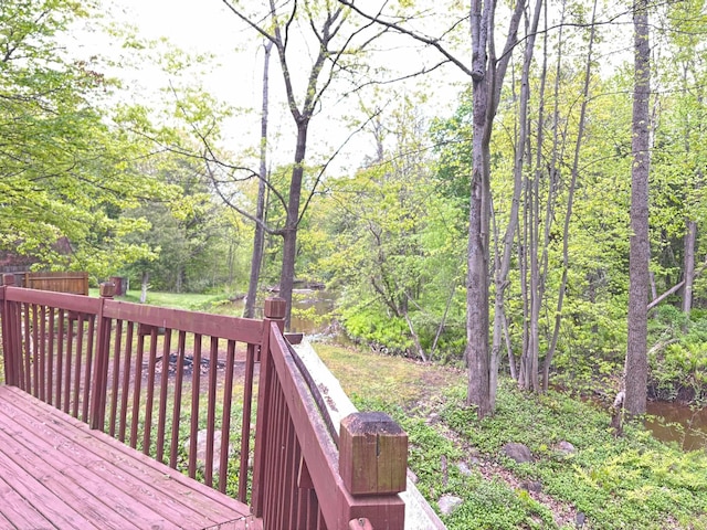 2913 W Howard Rd, Beaverton, MI 48612 - wooden deck featuring a view of trees