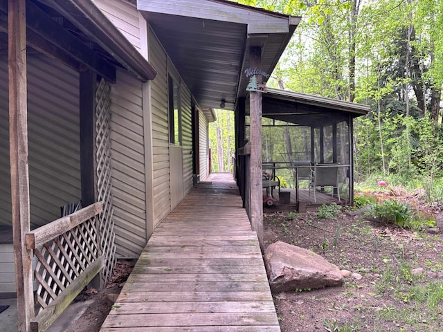 2913 W Howard Rd, Beaverton, MI 48612 - wooden terrace featuring a sunroom