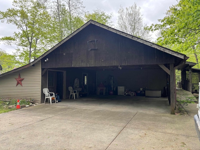 2913 W Howard Rd, Beaverton, MI 48612 - view of outbuilding with a carport and concrete driveway