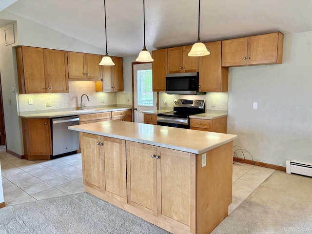 725 N Luxmore St, Ironwood, MI 49938 - kitchen featuring stainless steel appliances, a sink, light countertops, decorative backsplash, and a center island