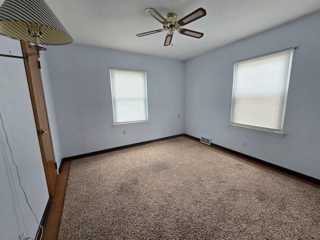 408 Sidney St, Bay City, MI 48706 - unfurnished room featuring carpet, ceiling fan, and baseboards