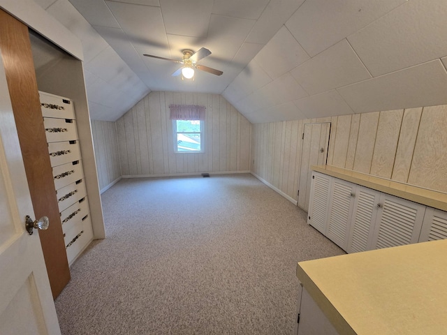 408 Sidney St, Bay City, MI 48706 - additional living space with lofted ceiling, light carpet, a ceiling fan, and baseboards