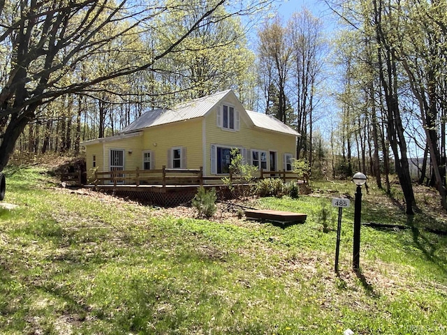 485 County Road Paj Rd, Ishpeming, MI 49849 - view of home's exterior with a wooden deck and metal roof
