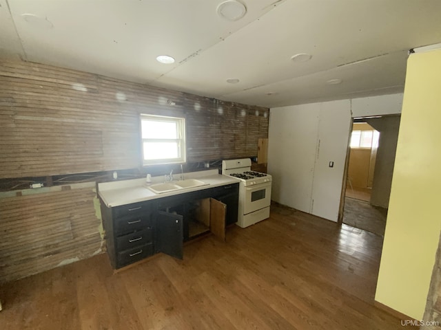 485 County Road Paj Rd, Ishpeming, MI 49849 - kitchen featuring white gas range oven, a sink, and wood finished floors